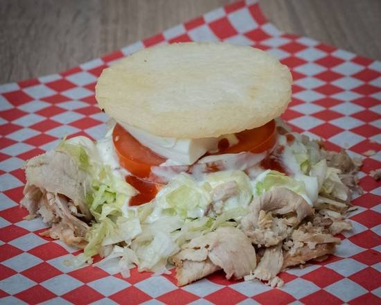 Pork arepa with pernil and melted cheese